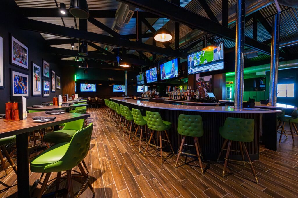 Par T Barn Center Bar top lined with green chairs