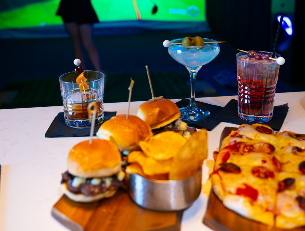 Par T Barn Golf Bay Countertop with three golf themed drinks and two boards of delicious food